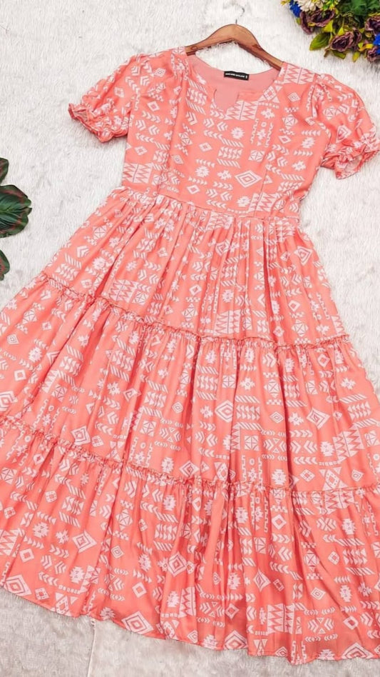 Pink dress with white patterns on a light gray background with flowers around